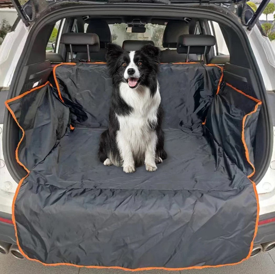 Border Collie sitting on waterproof SUV dog cargo liner inside a car, showcasing outdoor dog travel gear for large dogs.