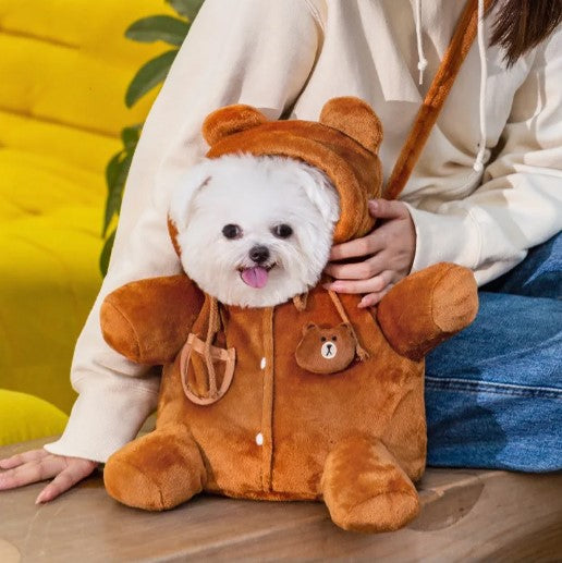 Warm pet backpack carrying a small white dog, ideal for winter trave