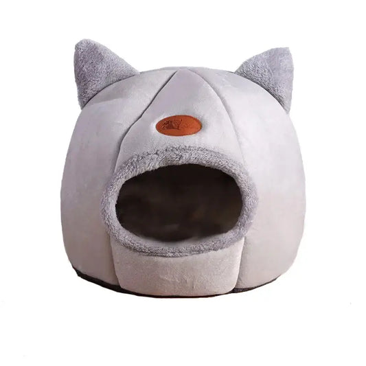 Deep sleep comfort cat bed in cave design, made with soft plush material and non-slip base for warm, cozy winter sleep.