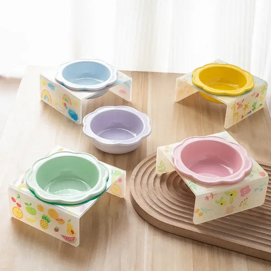 Flower-shaped ceramic pet bowl with clear acrylic stand for cats and dogs.