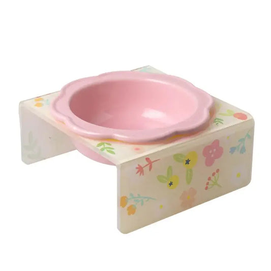 Flower-shaped ceramic pet bowl with clear acrylic stand for cats and dogs.