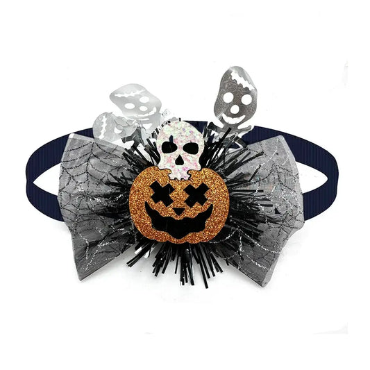 Dog wearing a cute pumpkin and skull Halloween bow tie for festive fun.