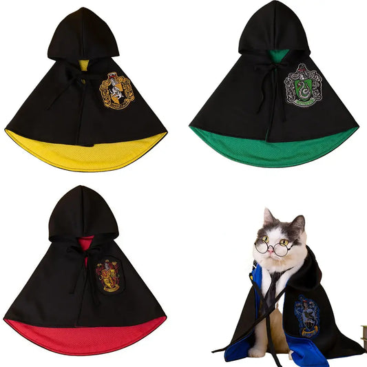 Cat or small dog wearing a shiny satin cape with magical Halloween theme.