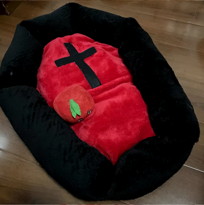Cat sleeping in a Halloween-themed plush pet nest bed.