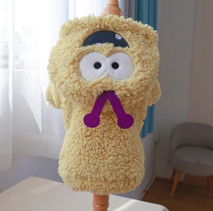 Small dog wearing a thick plush Halloween hoodie coat for chilly weather.