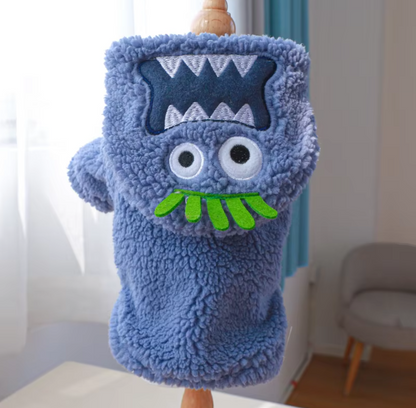 Small dog wearing a thick plush Halloween hoodie coat for chilly weather.