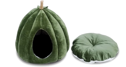 Pumpkin-shaped enclosed cat bed for winter warmth and Halloween decor.