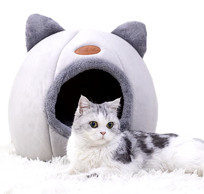 Deep sleep comfort cat bed in cave design, made with soft plush material and non-slip base for warm, cozy winter sleep.