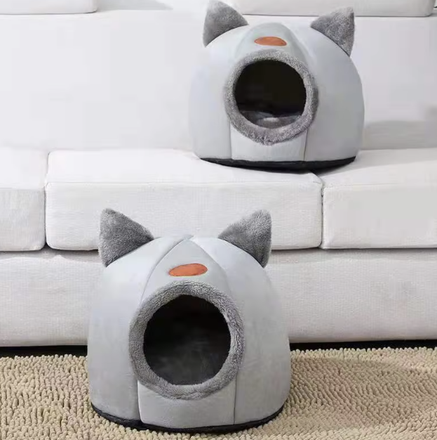 Cozy winter cat bed in cave design with removable cushion, perfect for keeping cats warm and comfortable during cold months.