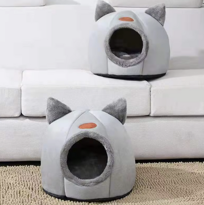 Deep sleep comfort cat bed in cave design, made with soft plush material and non-slip base for warm, cozy winter sleep.