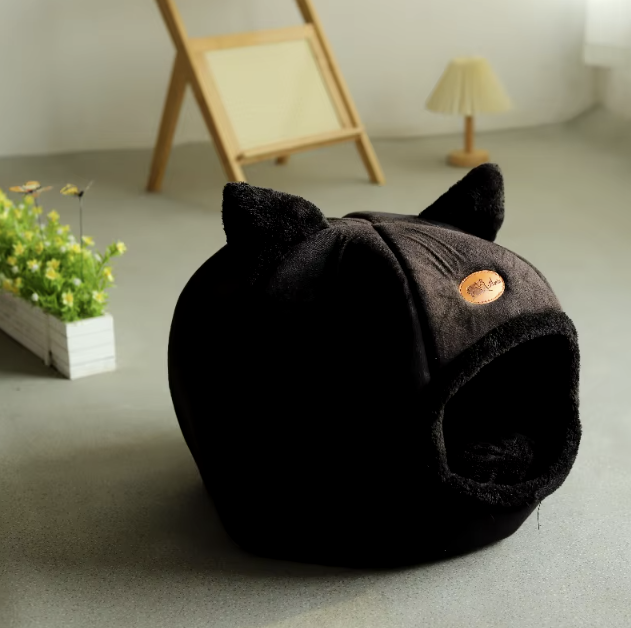 Cozy winter cat bed in cave design with removable cushion, perfect for keeping cats warm and comfortable during cold months.