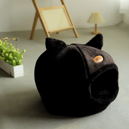 Deep sleep comfort cat bed in cave design, made with soft plush material and non-slip base for warm, cozy winter sleep.