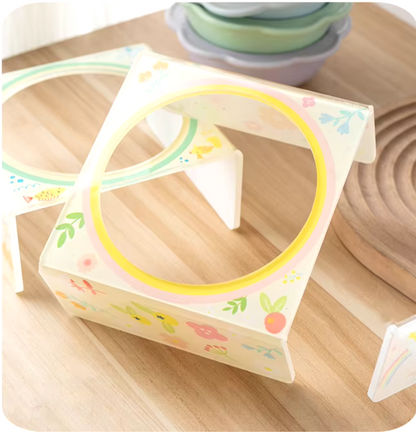Flower-shaped ceramic pet bowl with clear acrylic stand for cats and dogs.