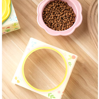 Flower-shaped ceramic pet bowl with clear acrylic stand for cats and dogs.