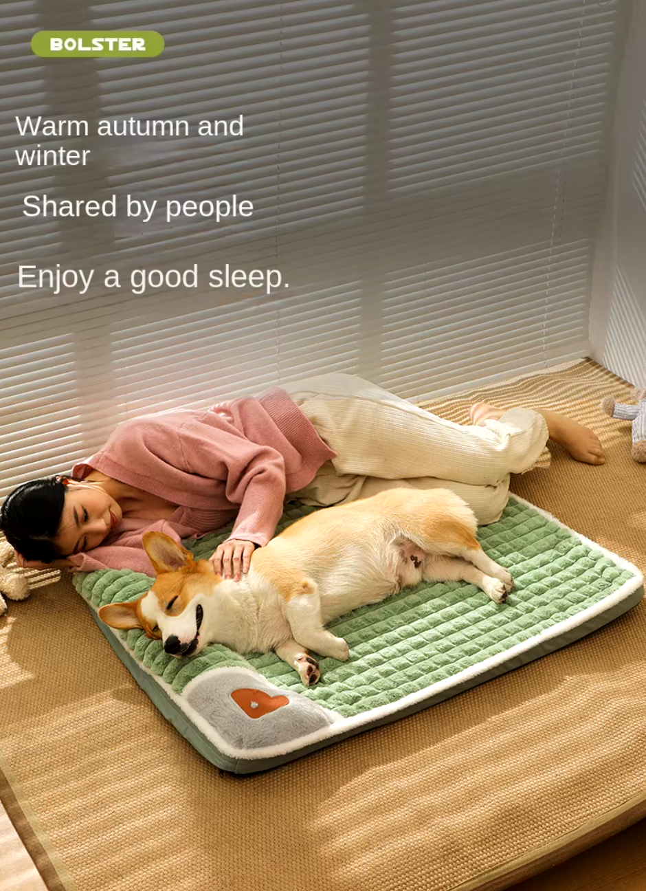 Thickened pet bed mat with plush fabric, washable cover, and anti-slip base, providing winter warmth for cats and dogs.