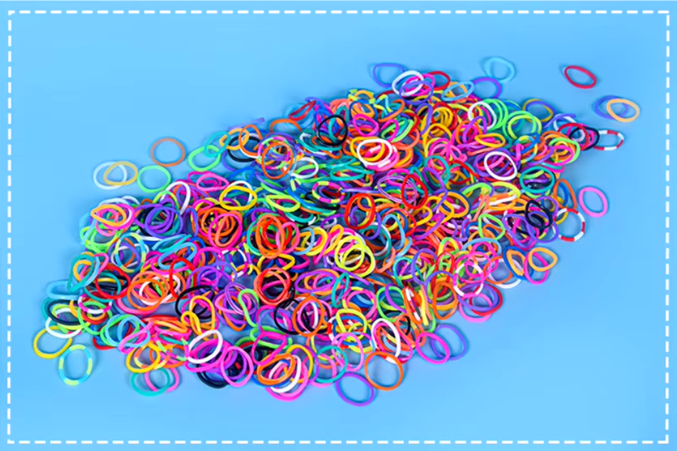 Colorful pet grooming rubber bands for DIY hair bows and accessories, perfect for all dog breeds.