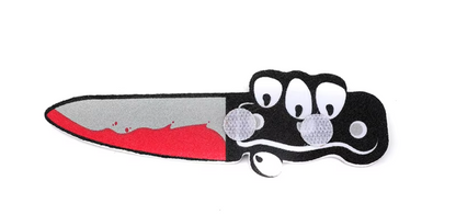 Medium-sized dog wearing a funny Halloween costume with adjustable straps.