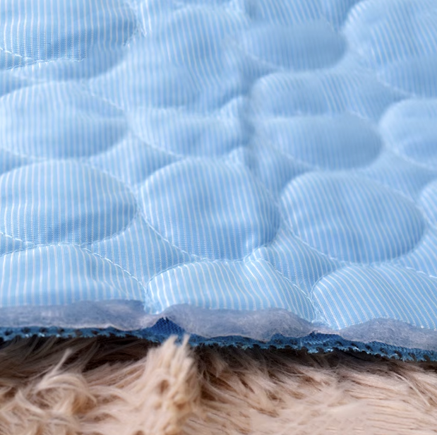 Pet cooling mat in ice silk fabric for summer comfort, suitable for dogs and cats in various sizes.