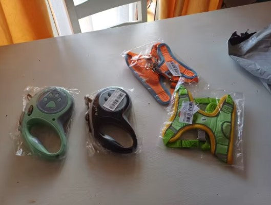 Teal and black dog leashes with packaging bag placed on a table, ideal for outdoor walking, training, and hiking - Customer review photo