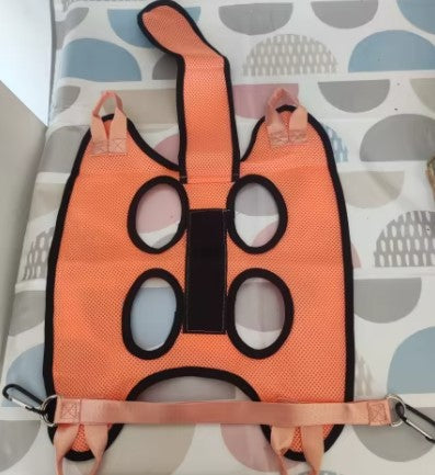 Laid-flat pet grooming harness with four leg openings, designed to safely suspend pets for easy nail trimming - Customer review photo