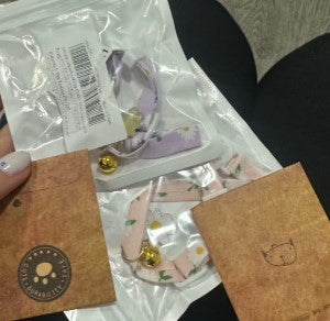 Two cat collars in purple and pink, each with a bell pendant - Customer review photo