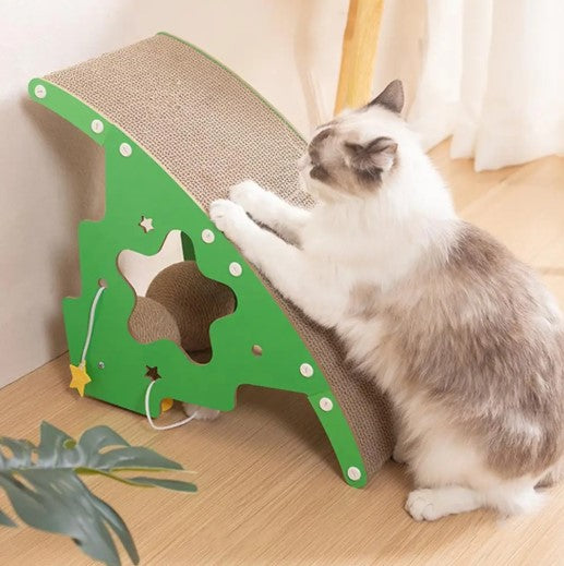 Cat scratching a green Christmas tree-shaped cat scratcher