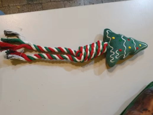 Green Christmas tree-shaped dog chew toy with ropes for interactive play - Customer review photo