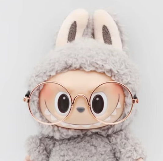 Small dog wearing round wizard cosplay glasses inspired by Harry Potter