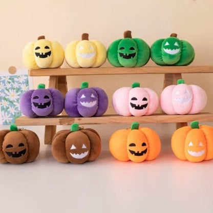 Small dog cuddling a Halloween pumpkin plush toy with night light.