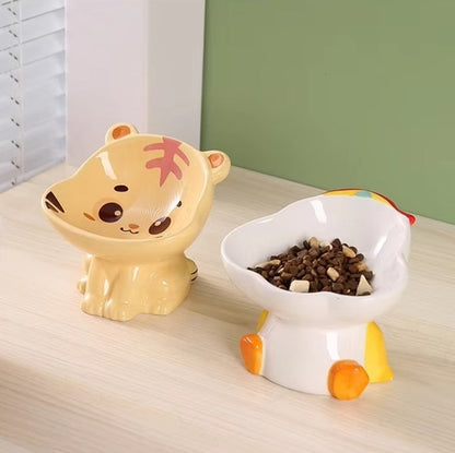Cute ceramic cartoon pet bowl elevated for cats and small dogs.