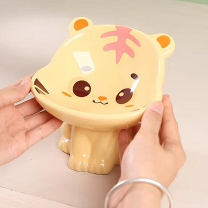 Cute ceramic cartoon pet bowl elevated for cats and small dogs.