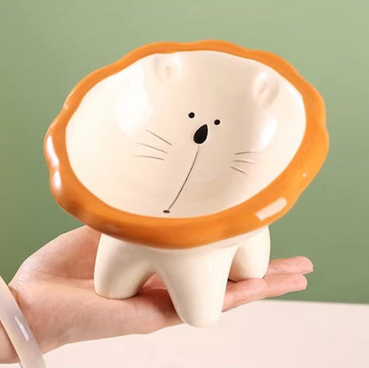 Cute ceramic cartoon pet bowl elevated for cats and small dogs.