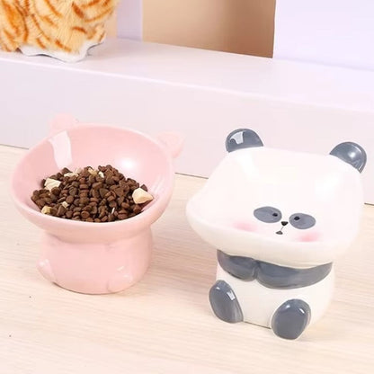 Cute ceramic cartoon pet bowl elevated for cats and small dogs.
