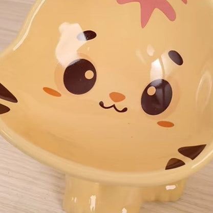 Cute ceramic cartoon pet bowl elevated for cats and small dogs.