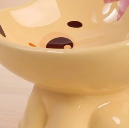 Cute ceramic cartoon pet bowl elevated for cats and small dogs.