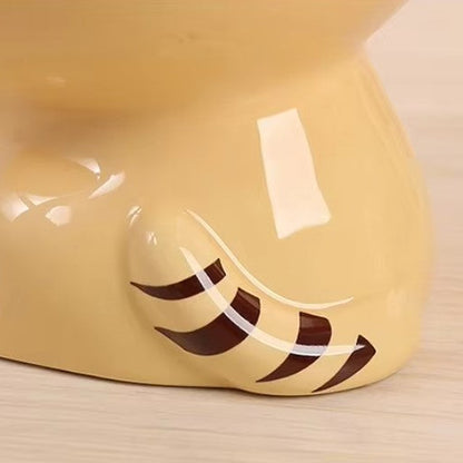 Cute ceramic cartoon pet bowl elevated for cats and small dogs.