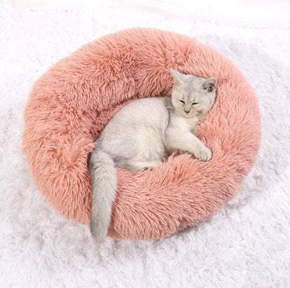 Ultra-soft round plush pet bed for cats and dogs, winter-ready with long plush fabric and non-slip base, available in sizes from 40cm to 90cm.