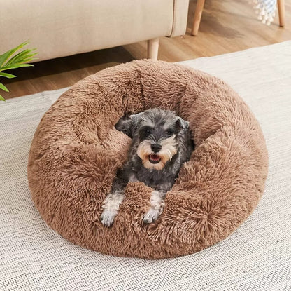 Ultra-soft round plush pet bed for cats and dogs, winter-ready with long plush fabric and non-slip base, available in sizes from 40cm to 90cm.