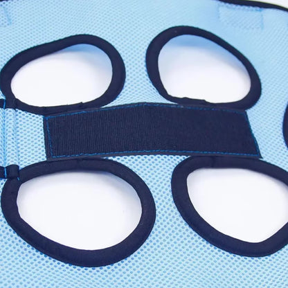 Cat suspended in a grooming hammock while getting its nails trimmed, safe and stress-free grooming tool