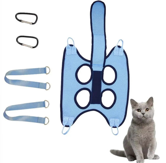 Cat suspended in a grooming hammock while getting its nails trimmed, safe and stress-free grooming tool