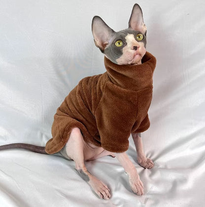 Hairless cat wearing turtleneck fleece winter sweater