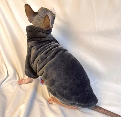 Hairless cat wearing turtleneck fleece winter sweater