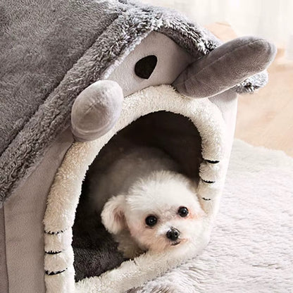 Small dog resting inside a foldable fleece dog kennel bed