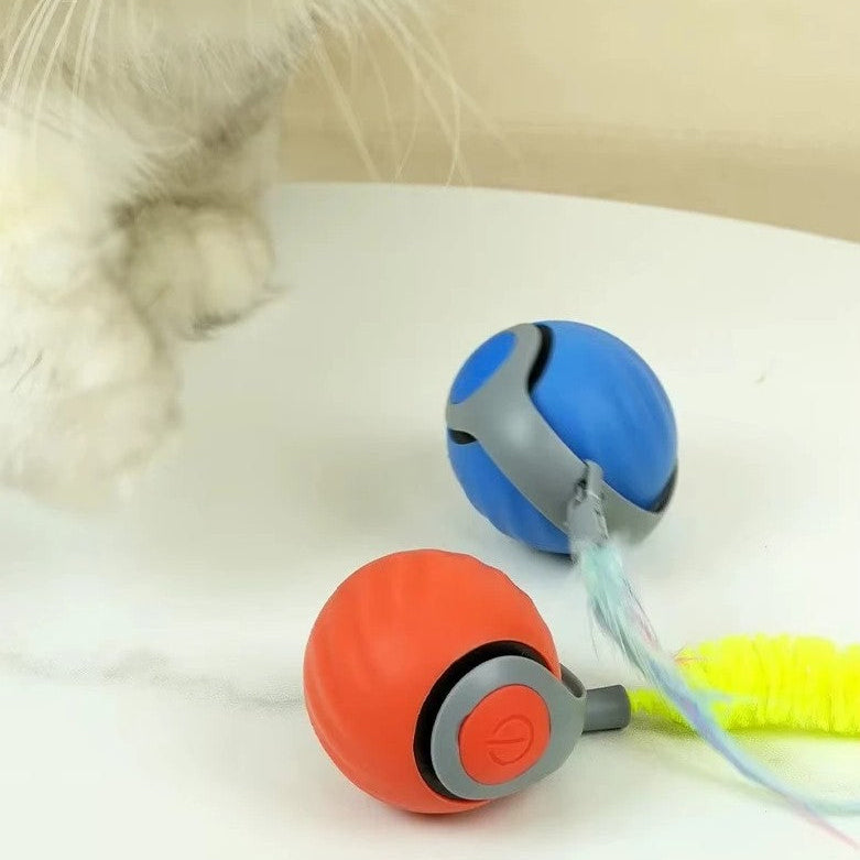 Interactive pet ball in blue and orange colors with a cat's paw nearby, designed for playful engagement.