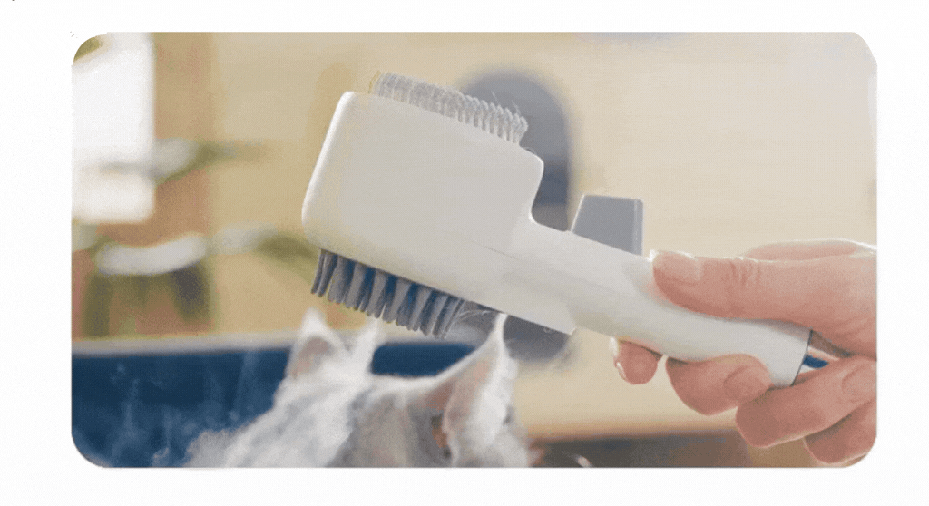 Pet Grooming SPA The Artisan™ Dual-Sided grooming brush for cats and dogs in use.
