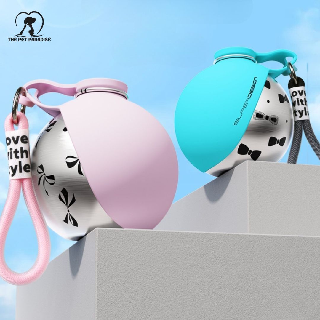 Dog travel water bottle in pink and blue with stylish silicone covers on a ledge, perfect for hydration on the go.