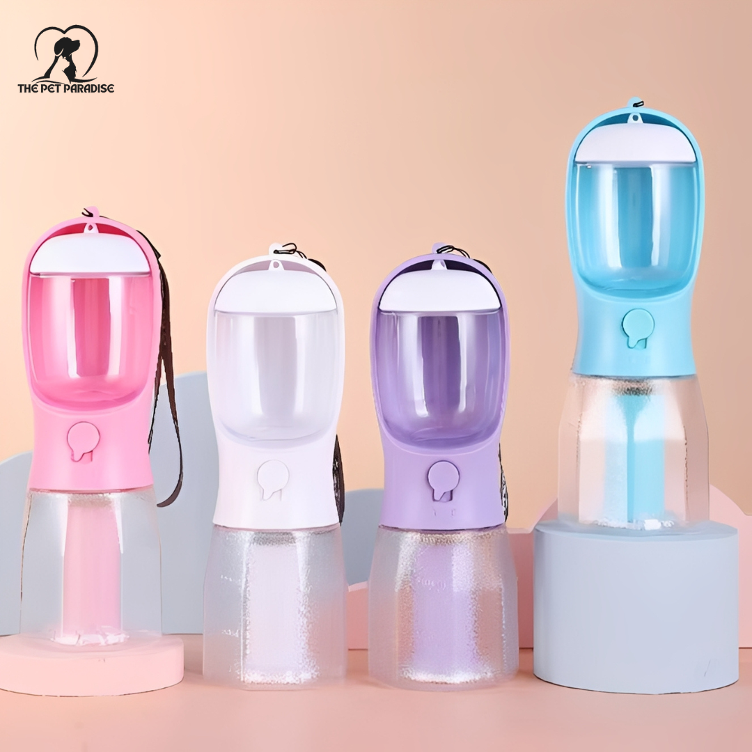 Collection of colorful dog travel bottles, including pink, white, purple, and blue, perfect for outdoor adventures.