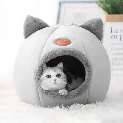 Deep sleep comfort cat bed in cave design, made with soft plush material and non-slip base for warm, cozy winter sleep.