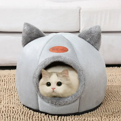Deep sleep comfort cat bed in cave design, made with soft plush material and non-slip base for warm, cozy winter sleep.