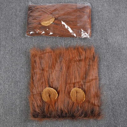 Dog wearing a fluffy lion mane costume hat.